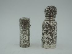 A Victorian scent phial having moulded foliate decoration, hinged lid and glass stopper,