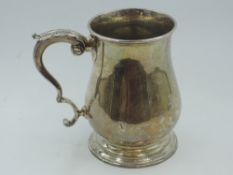 A Victorian silver Christening tankard of plain baluster form bearing presentation inscription and