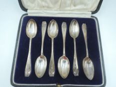 A cased set of six silver teaspoons having moulded floral swag decoration, London 1925/27, Josiah