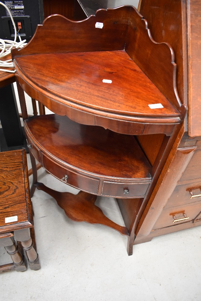 A reproduction mahogany corner wash stand