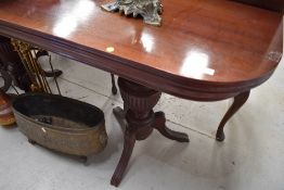 A reproduction console table having lift top (no support?)