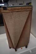 A vintage woven fibre linen basket