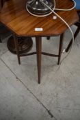 An Edwardian mahogany octagonal occasional table having line inlay decoration, with shaped X