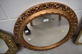 A vintage gilt plaster wall mirror, of circular form , diameter approx. 60cm