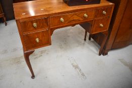 An early to mid 20th Century art walnut dressing table/kneehole desk, on cabriole legs, width