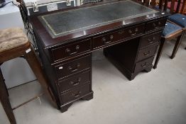 A reproduction mahogany pedestal desk having leather 'skiver' top , width approx. 122cm