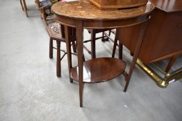 An early 20th Century mahogany oval occasional table having marquetry work top