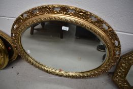A vintage gilt frame oval wall mirror, diameter approx. 75cm