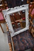 A scroll frame wall mirror, over painted , approx 55 x 45cm