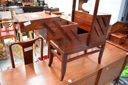 A traditional cantilever sewing box, dark stained