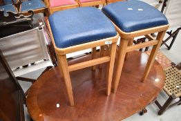 A pair of vintage kitchen stools, with drop in vinyl seats, height approx. 55cm