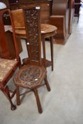 A late 19th or early 20th Century carved oak spinning chair