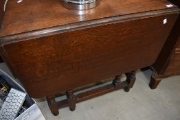An early to mid 20th Century oak twist gate leg dining table