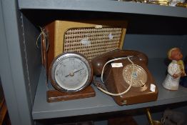 A selection of hardware including brown telephone and portable radio