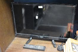 A modern Seiki 24inch television set with remote