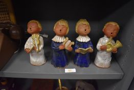 A set of four terracotta figures of a choir of angles