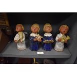 A set of four terracotta figures of a choir of angles