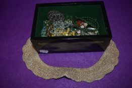 A selection of costume jewellery including glass beads and simulated pearls in hand decorated box