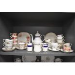 A selection of tea cups saucers and tea wares including Heathcote Sheraton