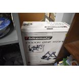 A modern in door bike or cycle trainer in box by Bikemate