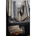 A selection of vinyl records and albums with some 45rpm singles