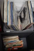 A selection of vinyl records and albums with some 45rpm singles