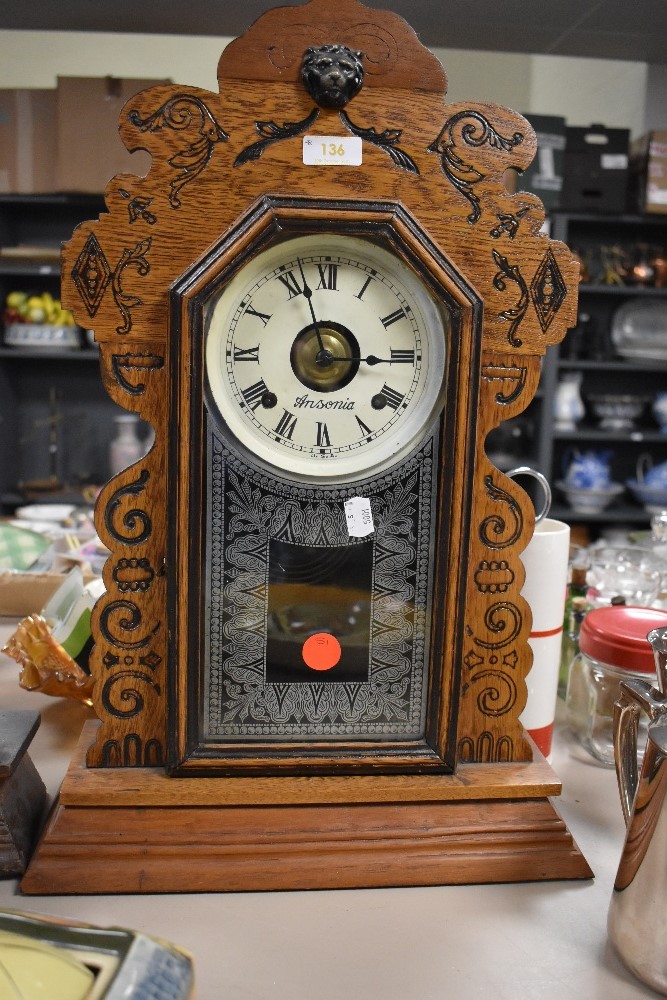 An Ansonia Clock Co, America 8 day gingerbread clock