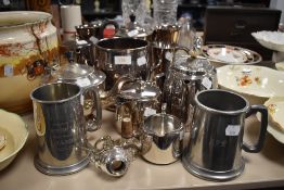 A selection of plated wares and pewter, tankards, jugs, tea pots and more.