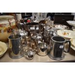 A selection of plated wares and pewter, tankards, jugs, tea pots and more.