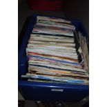 A box full of mixed 45RPM singles, including Roxy music, Brenda lee,Thompson twins and more.