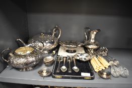 A selection of table wares and plated wares including a tea set and cutlery