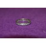 A white metal and paste full eternity ring stamped sil,size 0