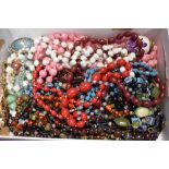 A selection of costume jewellery strings of beads of various forms