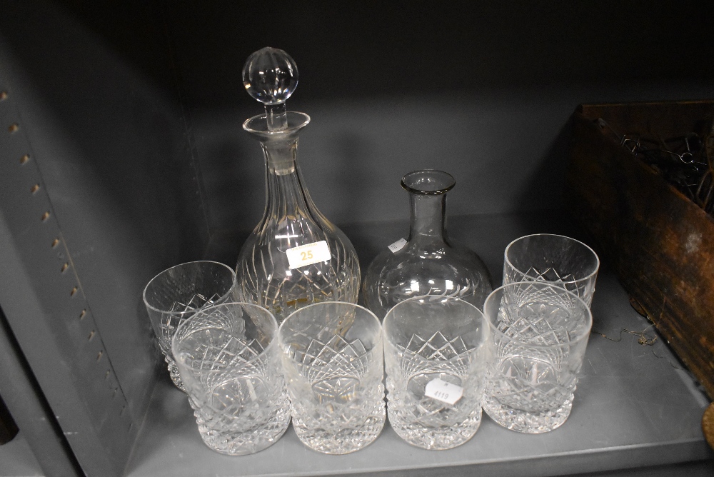 Six glass whiskey tumblers and two cut glass decanters