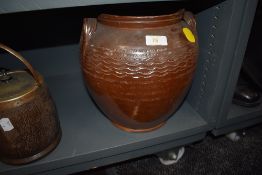 A large earthen wares slat glazed grain bin