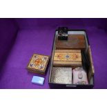 A selection of misc items including lapel pins, small wooden jewellery boxes, Rhodesian coins, key