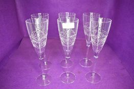 A set of six Edinburgh crystal champagne flutes in the Orrin design