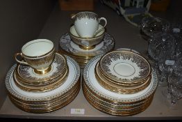 An assortment of china including Foley with extensive gilt detailing.
