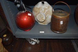 A mid century cocktail mixer soda syphon, an oak cased biscuit barrel and a ceramic foot warmer