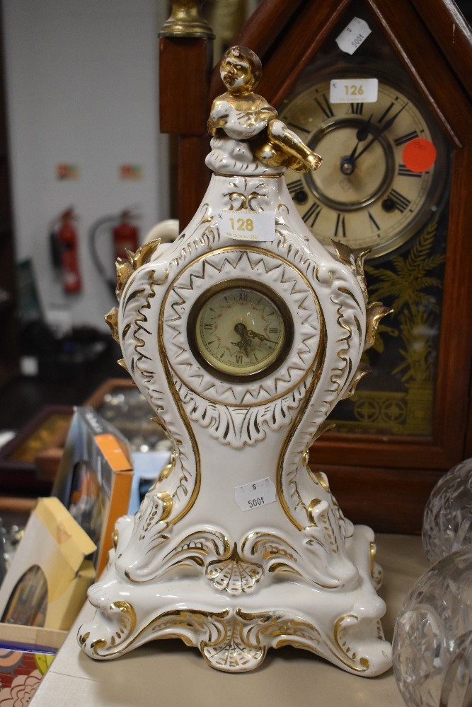 A ceramic mantel clock made in Italy with a German movement