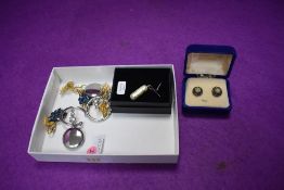 A small selection of costume jewellery including an Iona Marble pendant on a silver chain, similar