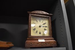 A small bracket clock having and oak case and movement marked W&H Sch