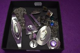 A selection of stainless steel jewellery including pendants, earrings, rings, LRI Borrowdale tie