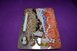 A selection of costume jewellery inclusing strings of beads, earrings etc