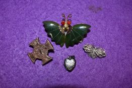 A small selection of jewellery including a British Columbian jade brooch in the form of a butterfly,