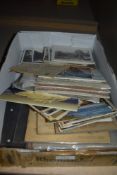 A selection of postcards and ephemera including black and white photograph