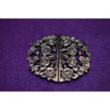 A silver plated nurses buckle having floral moulded decoration