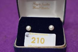 A pair of cultured pearl stud earrings on 9ct gold posts