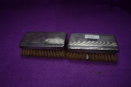 A pair of gent's HM silver backed brushes, Birmingham 1946, F H Adams & Holman