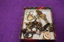 A selection of rolled gold and gold plated costume jewellery including lockets, Seiko wrist watch,